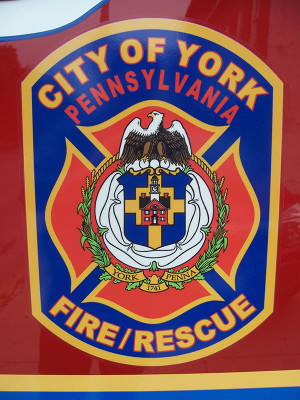 City of York Fire Department Maltese cross emblem on fire engine