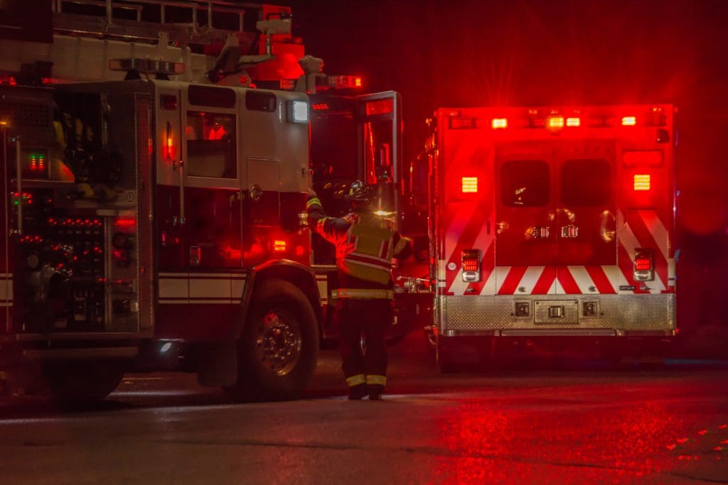 fire truck, firefighter, ambulance responding to car crash at night